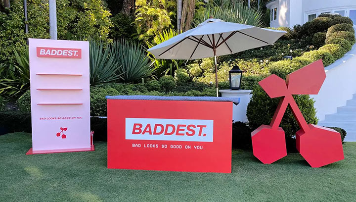 Corporate event freestanding sign for Baddest with a bar and cherry sculpture.