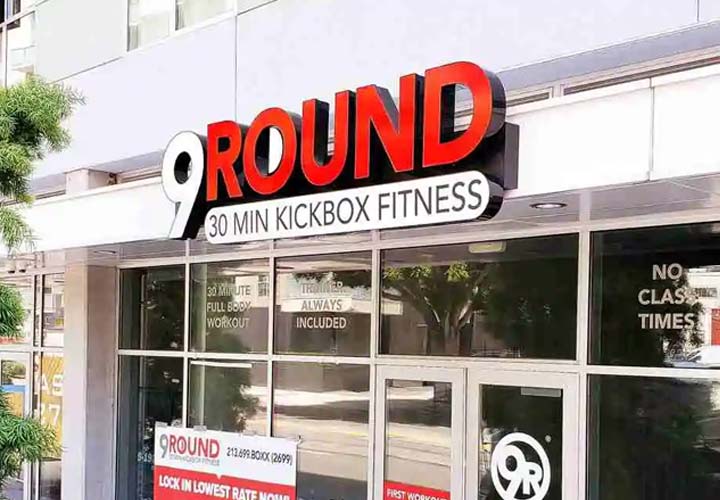 Large outdoor channel letter sign for 9Round on the storefront.