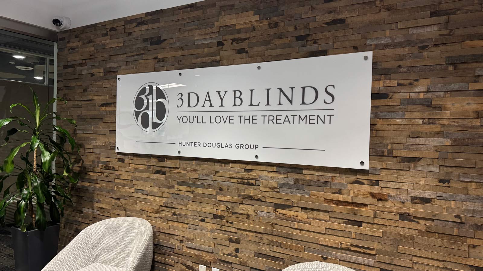 3 day blinds reverse printed acrylic sign on lobby wall