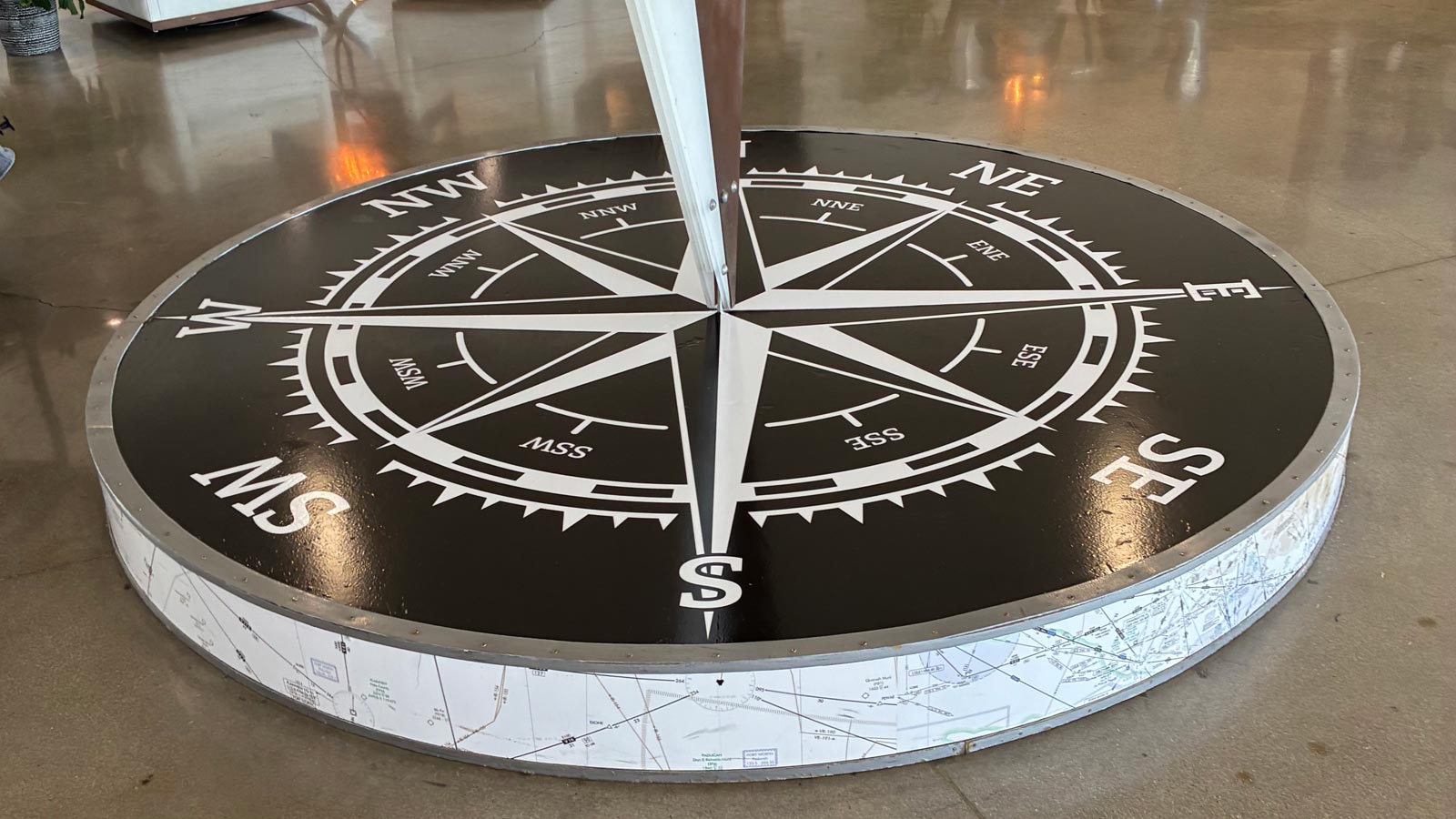 aaa construction compass floor graphic applied to plinth