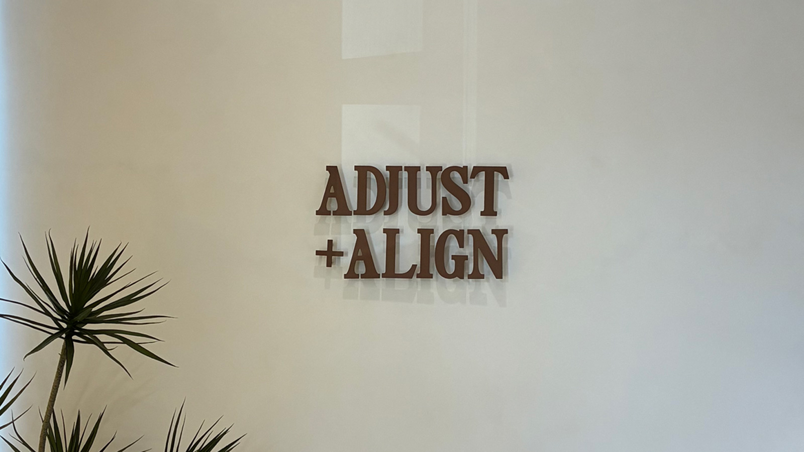 adjust align aluminum letters mounted on office wall
