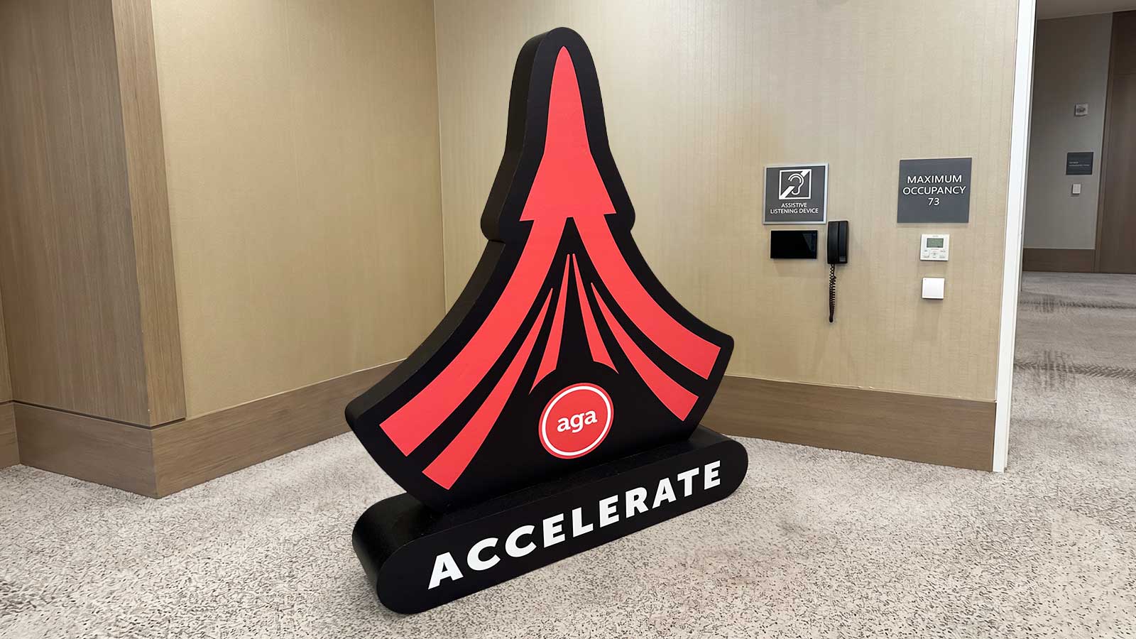 aga accelerate freestanding foam logo display at event