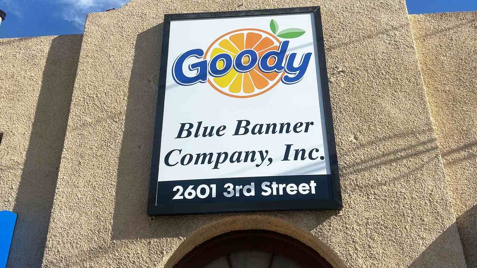 blue banner company cabinet sign face replaced on storefront