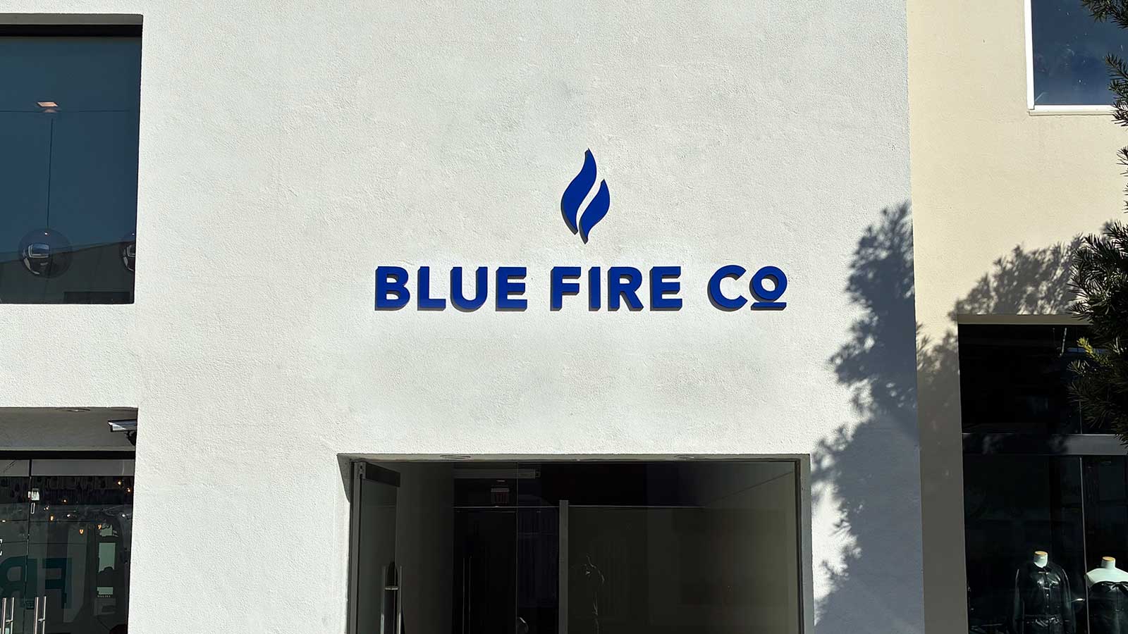 blue fire co painted pvc letters mounted on building