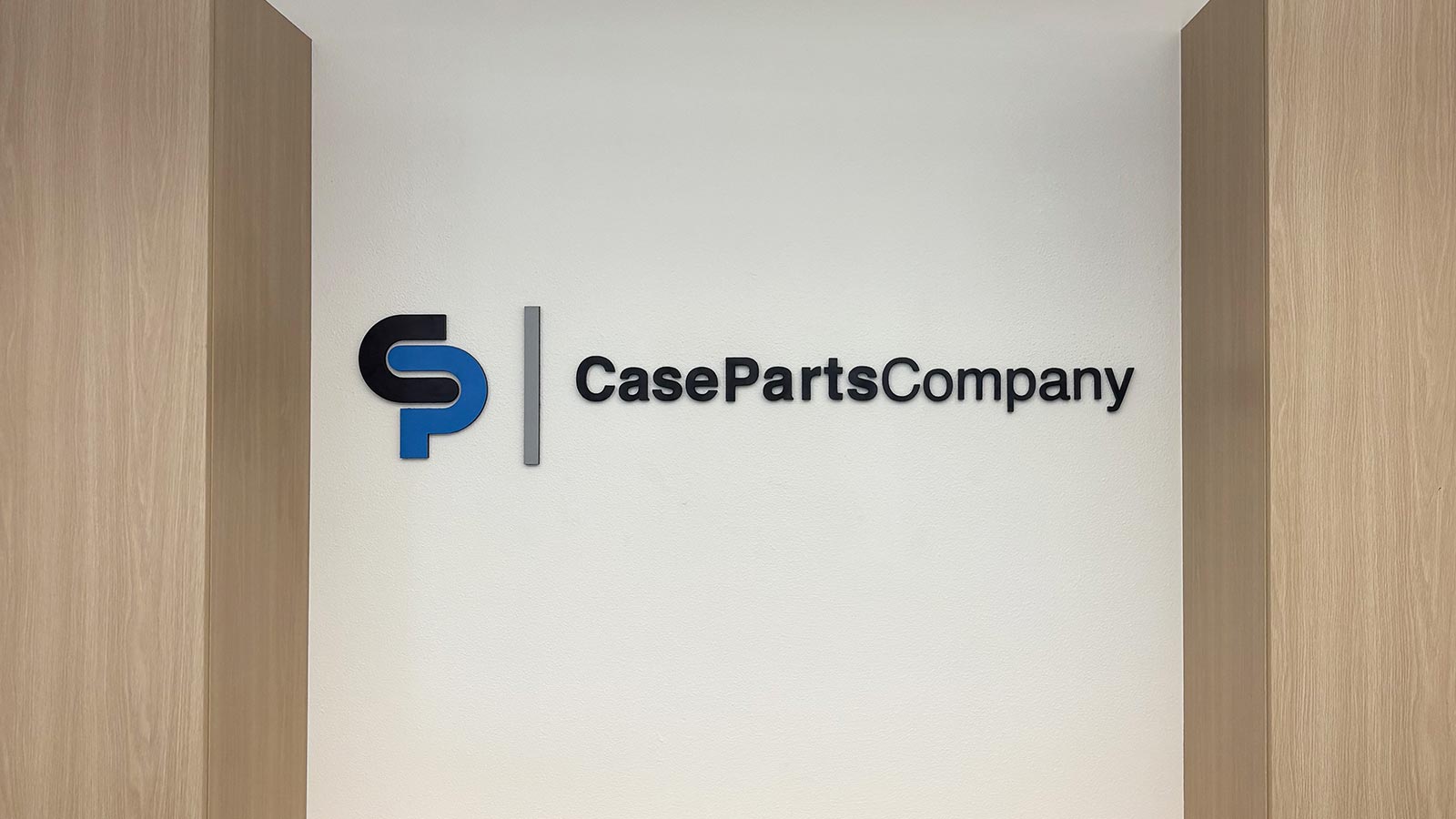case parts company printed ultra board sign on lobby wall