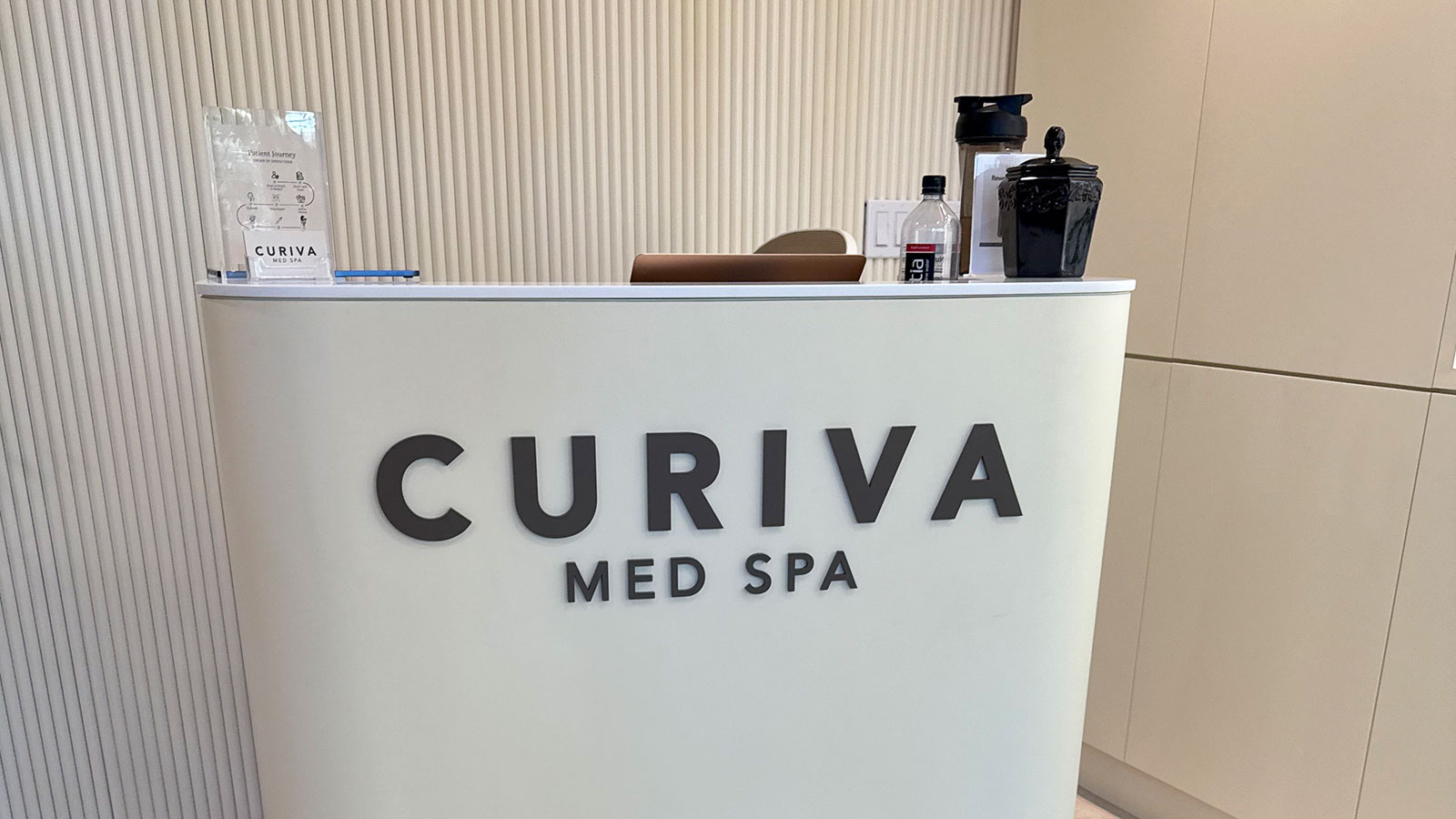 curiva med spa acrylic letters mounted on reception desk