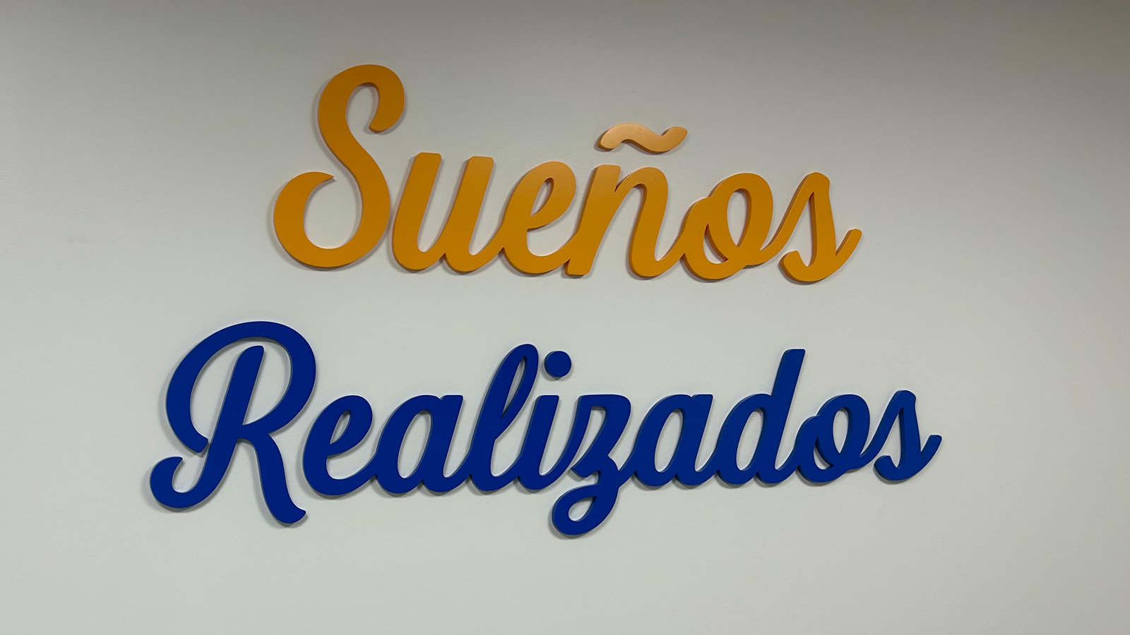 dyad immigration law acrylic lettering mounted on wall