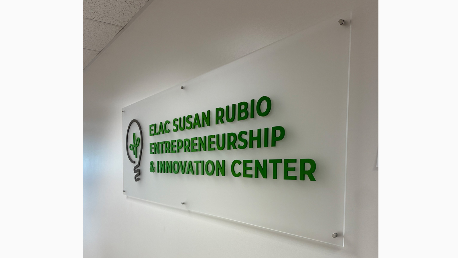 elac foundation frosted acrylic sign mounted on wall