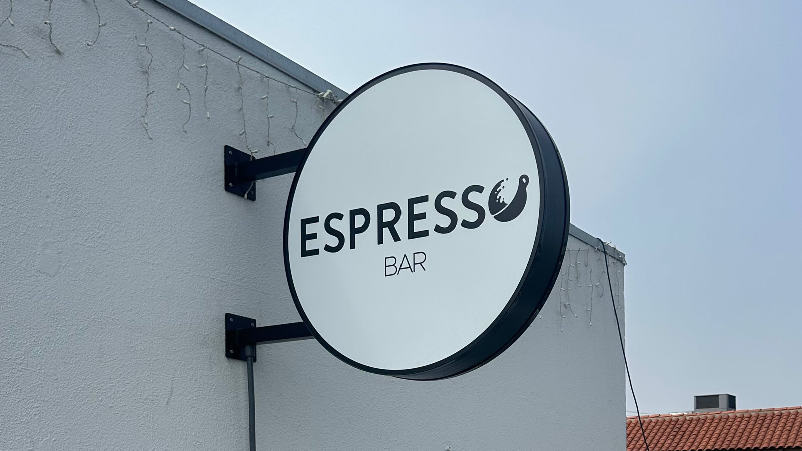 espresso bar blade sign face replaced on storefront