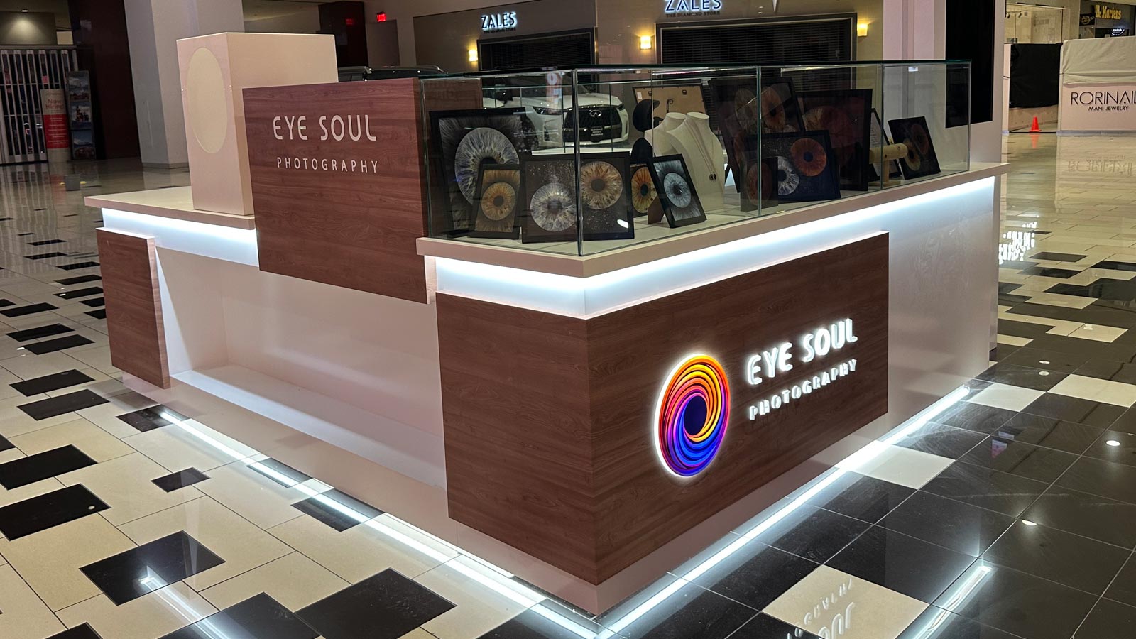 eye soul photography illuminated logo mounted on kiosk