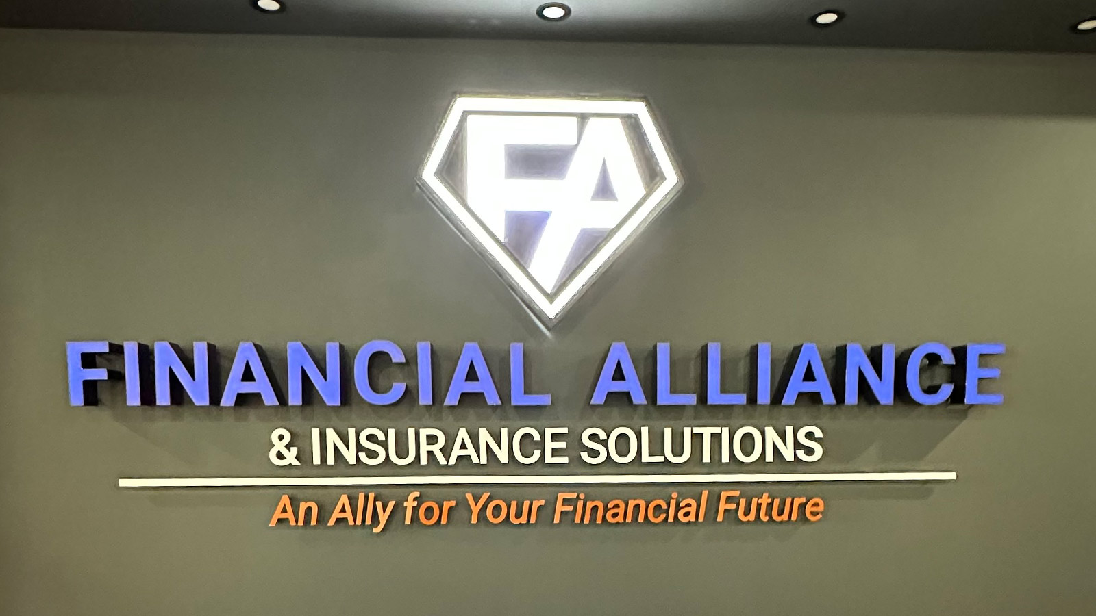 financial alliance lobby sign mounted on the wall