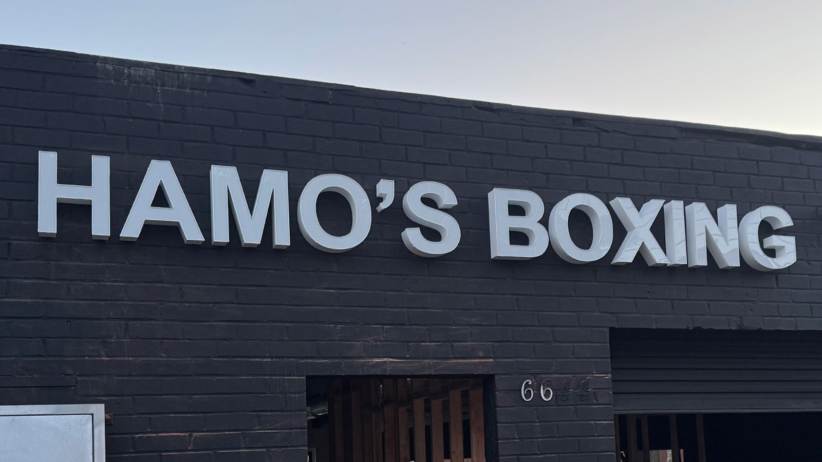 hamos boxing channel letters mounted on storefront