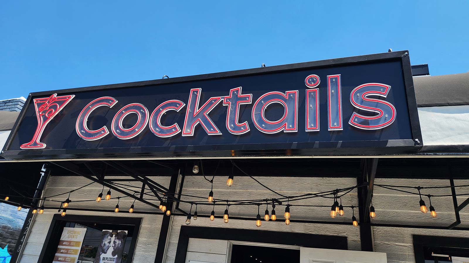 happy rabbit bar sign repaired and reinstalled outdoors