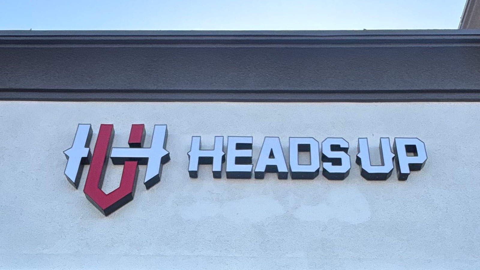 heads up front lit channel letters mounted on storefront