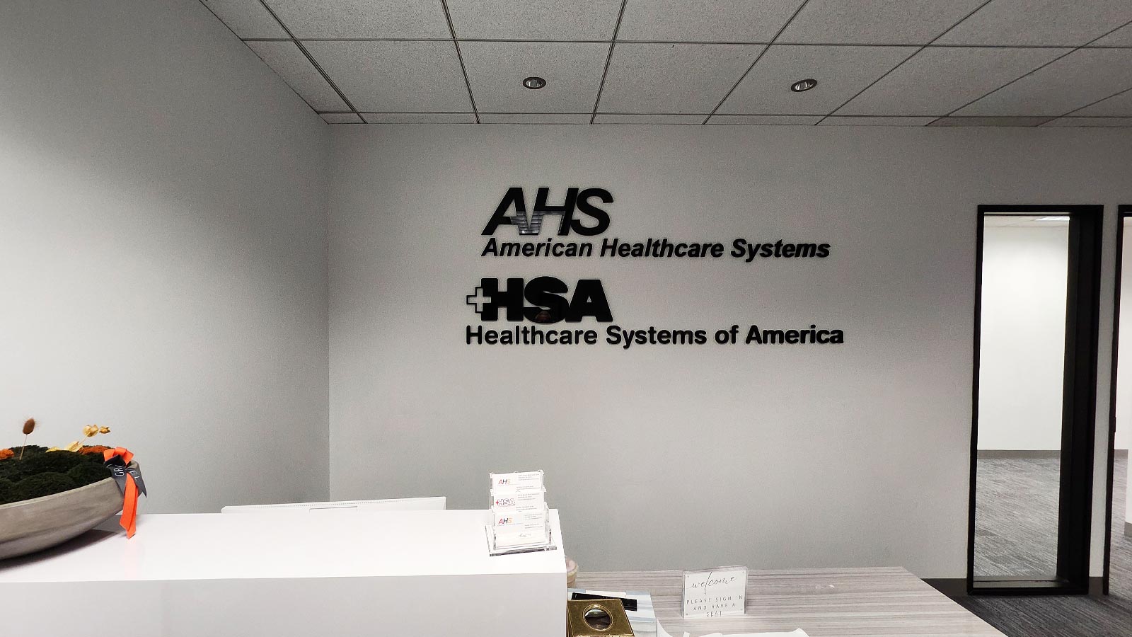 healthcare systems of america acrylic sign mounted on wall