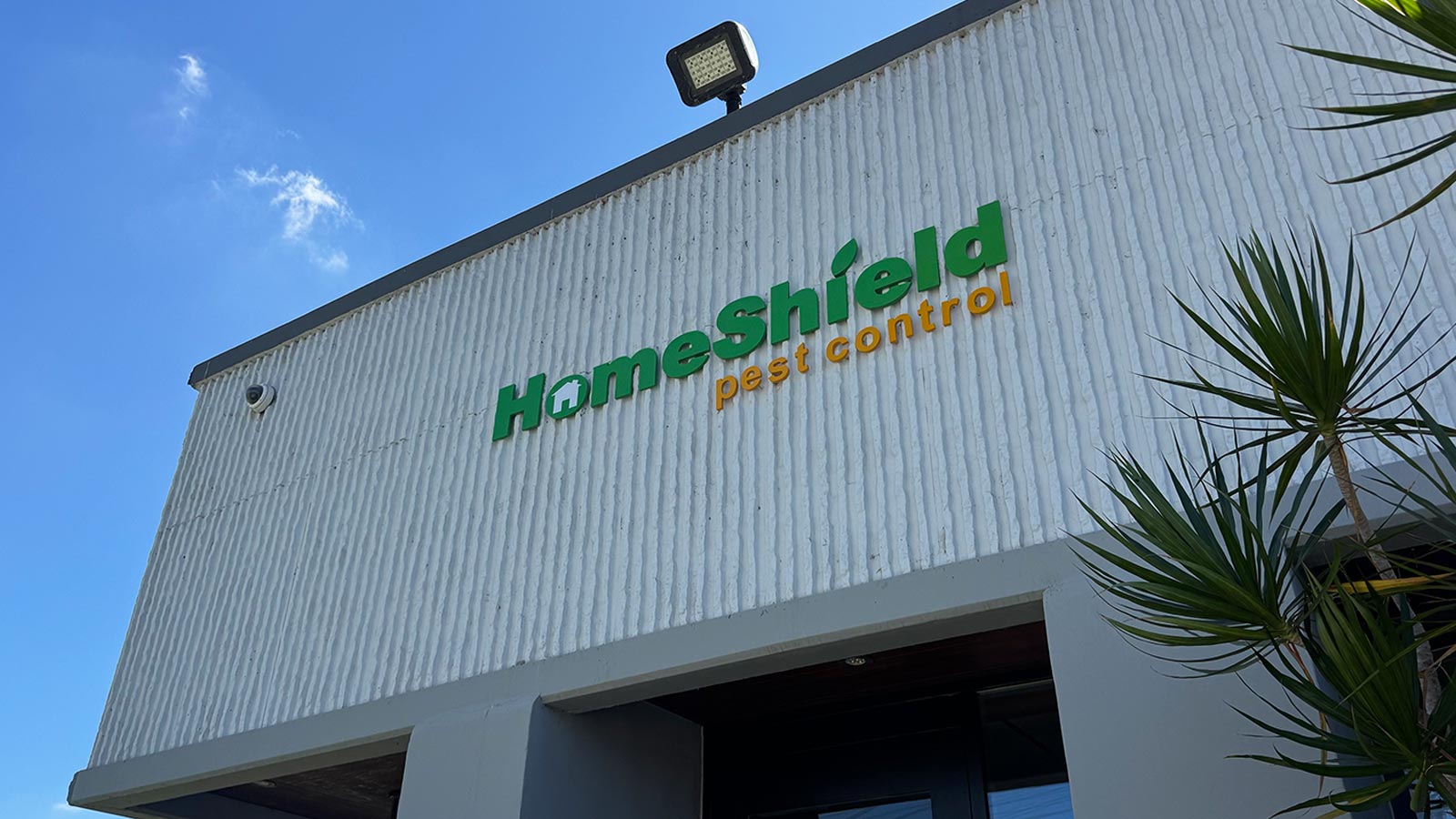 homeshield pest control acrylic letters mounted on building