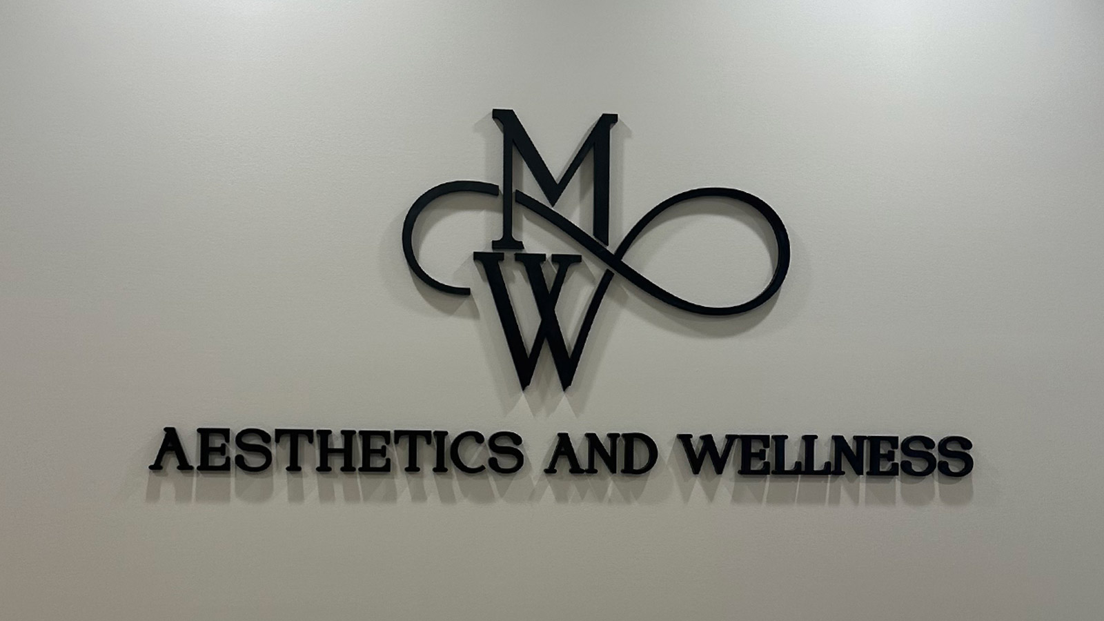 jb and sb management acrylic lobby sign mounted on wall
