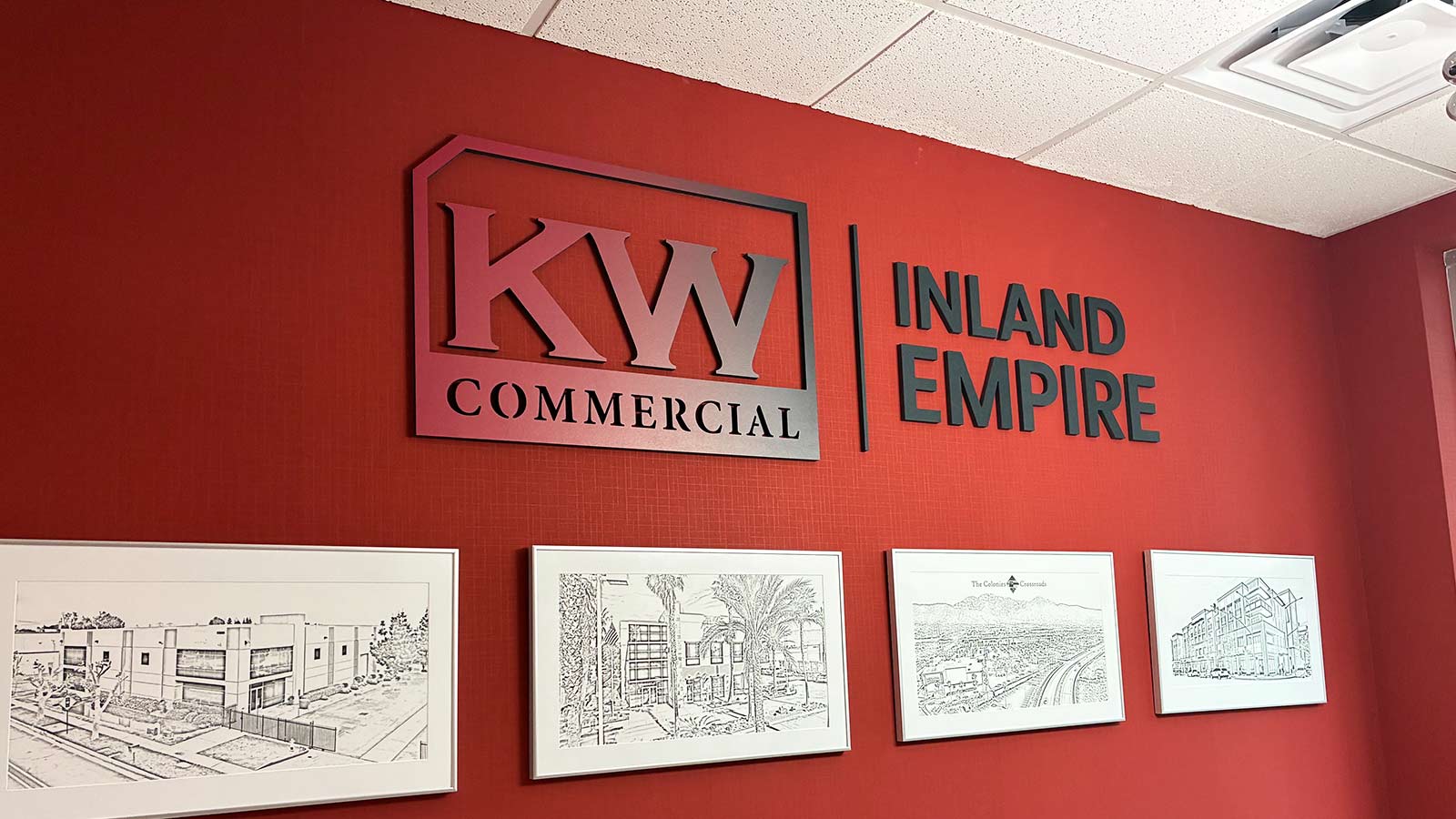 kw commercial inland empire logo sign repair on office wall