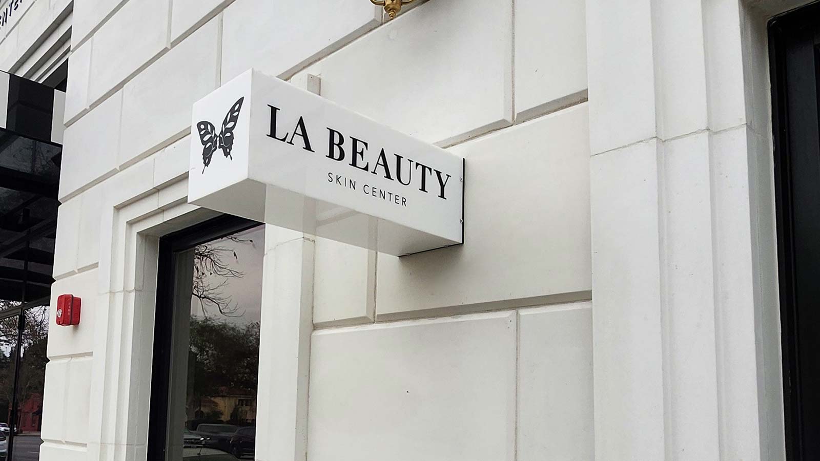 la beauty skin center lightbox sign mounted on storefront