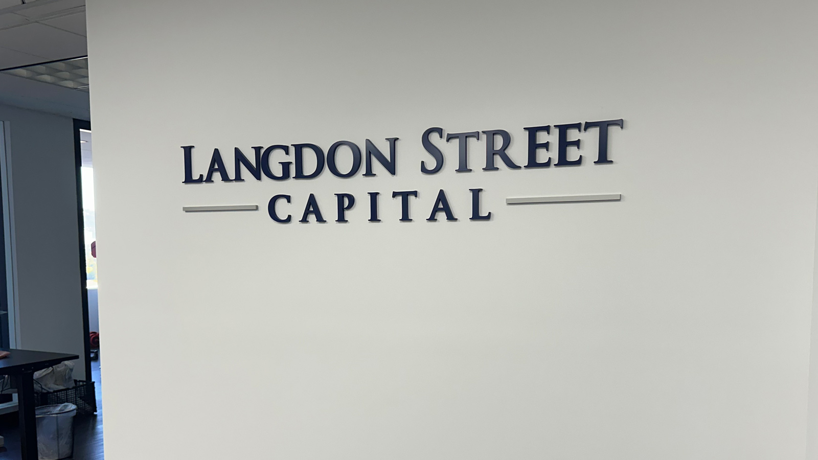 langdon street capital acrylic letters on office wall