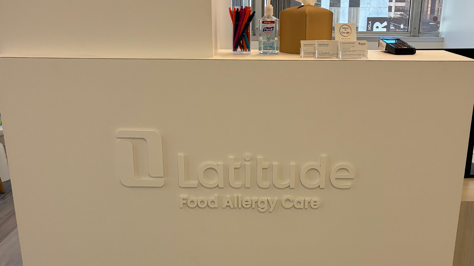 latitude food allergy care office sign on interior wall