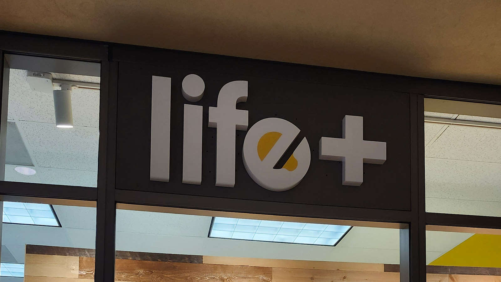 life plus non-illuminated letters on storefront