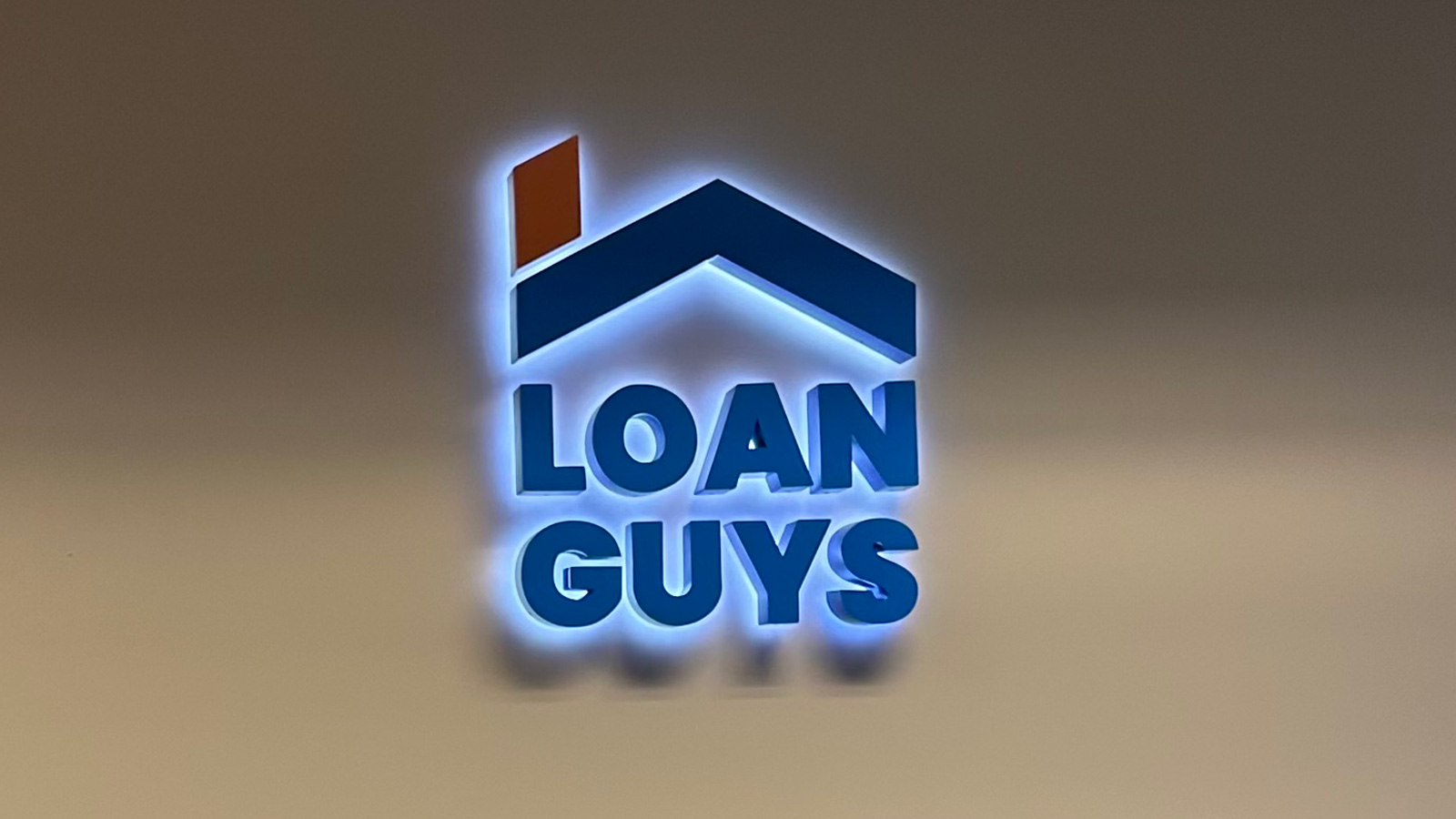 loan guys halo lit channel letters mounted on wall