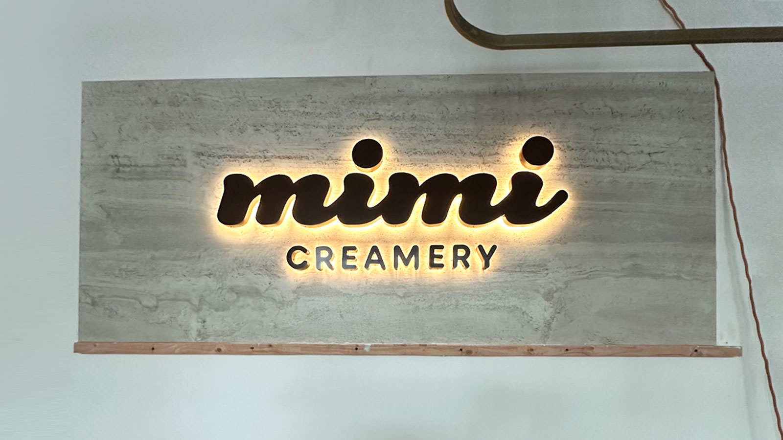 mimi creamery back lit channel letters on interior wall