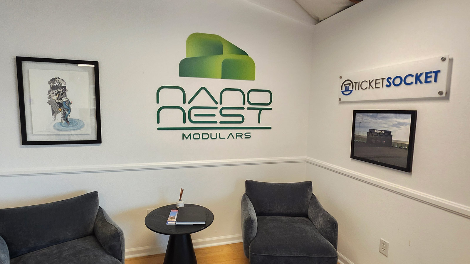 nanonests corp acrylic logo and letters on office wall