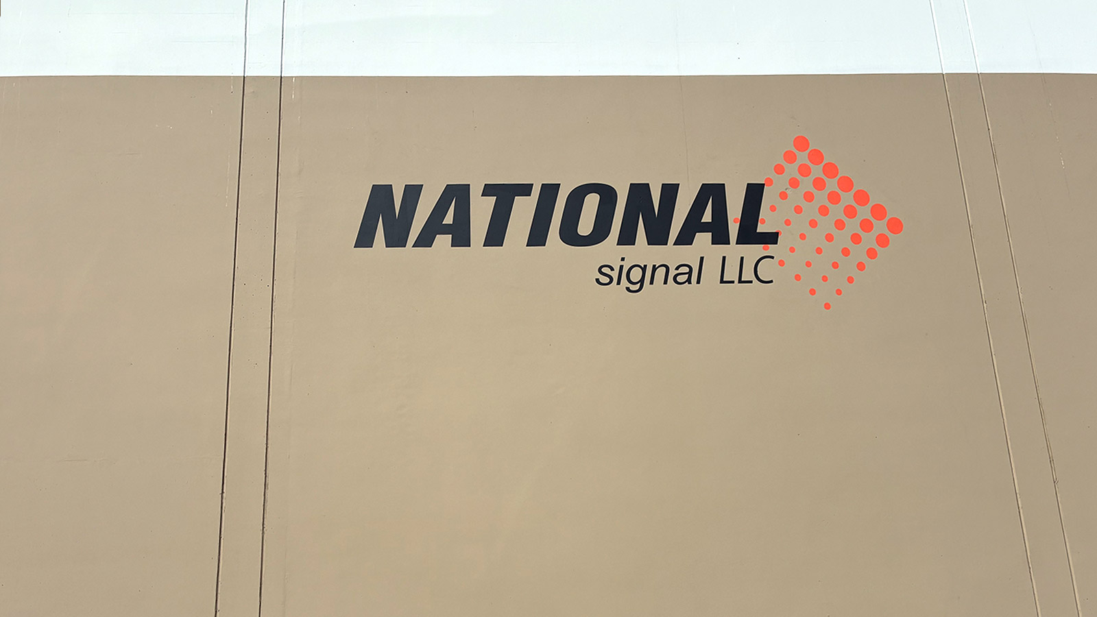 national signal painted logo and letters on building wall