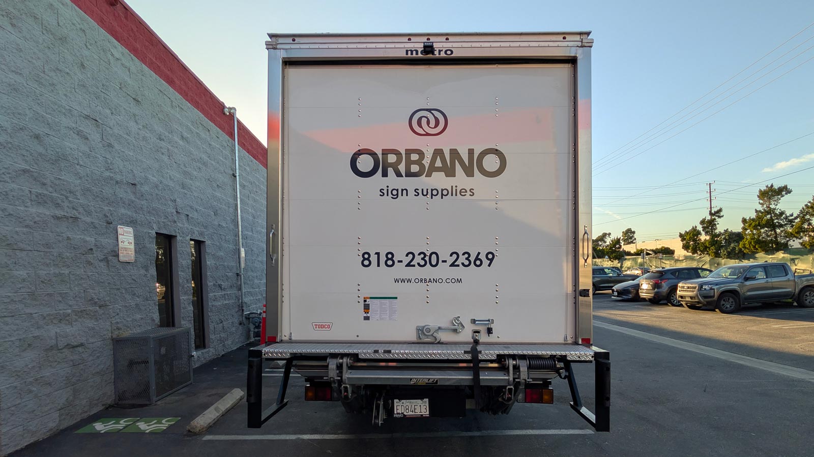 orbano sign supplies vinyl lettering on truck rear panel