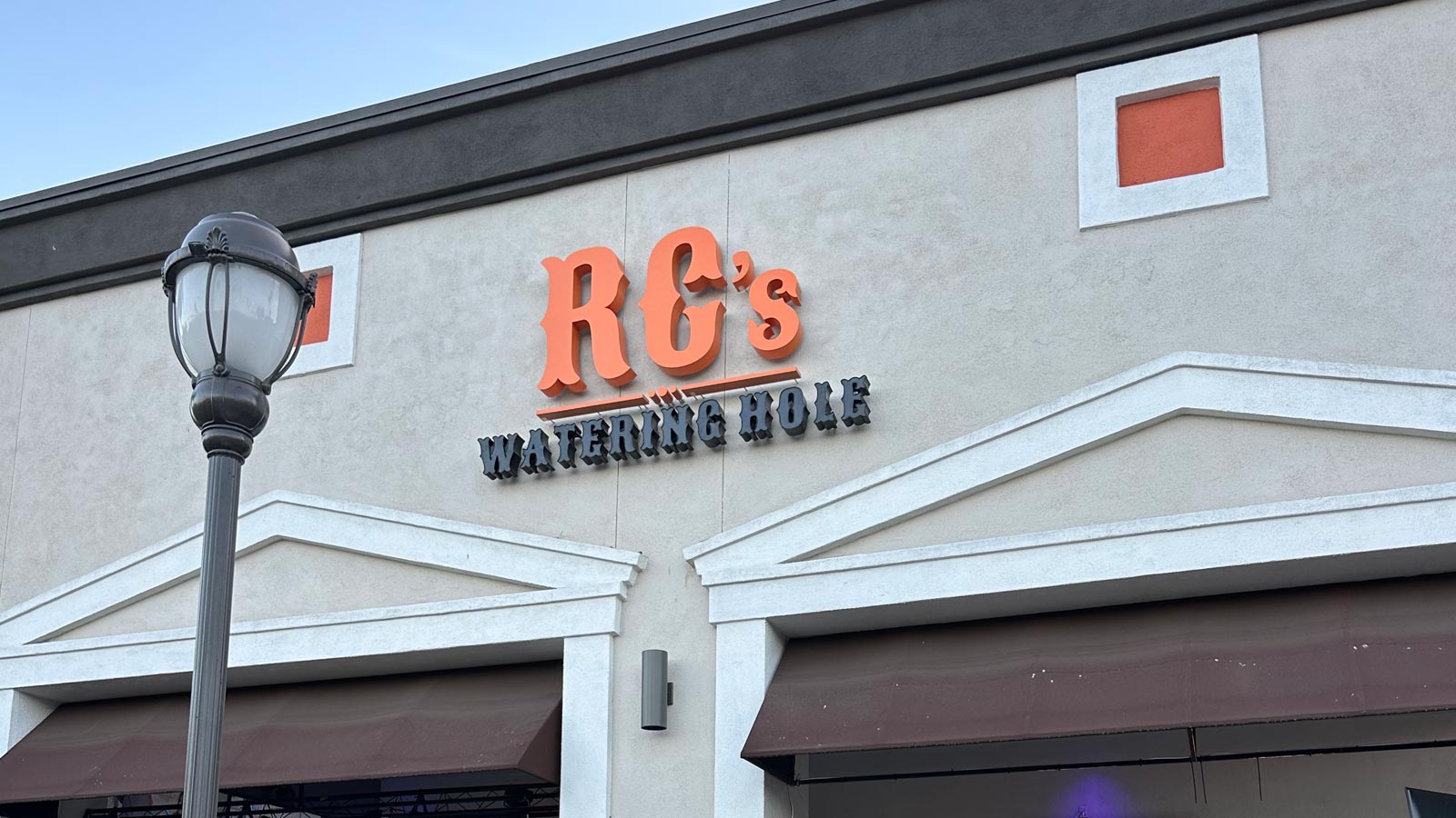 rcs watering hole back-lit channel letters and logo on wall
