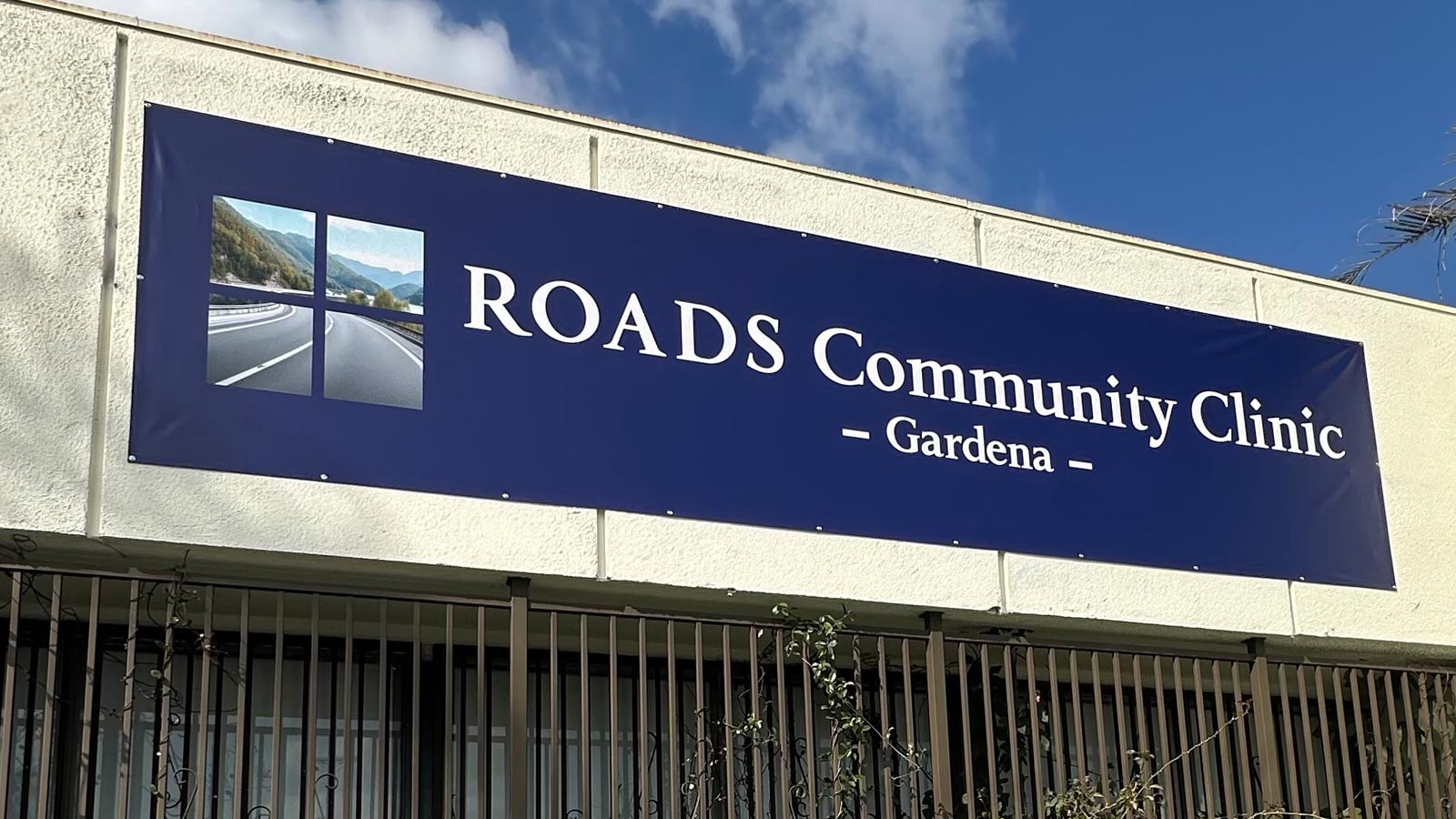 roads community clinic vinyl banner mounted on wall