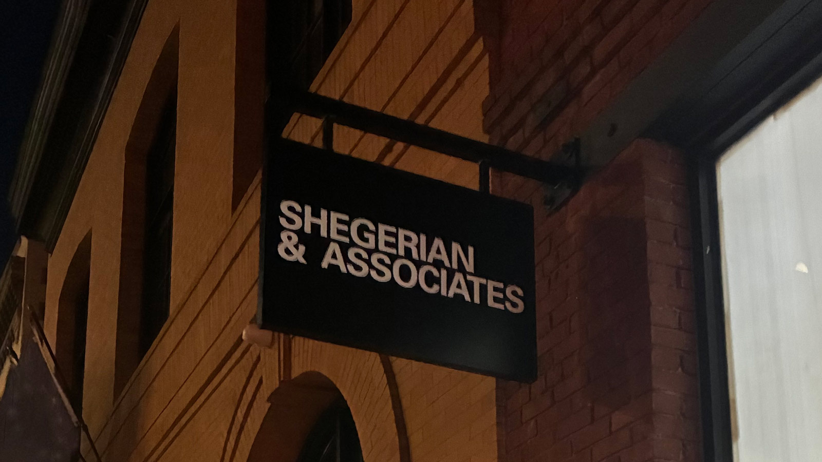 shegerian and associates blade sign mounted on building