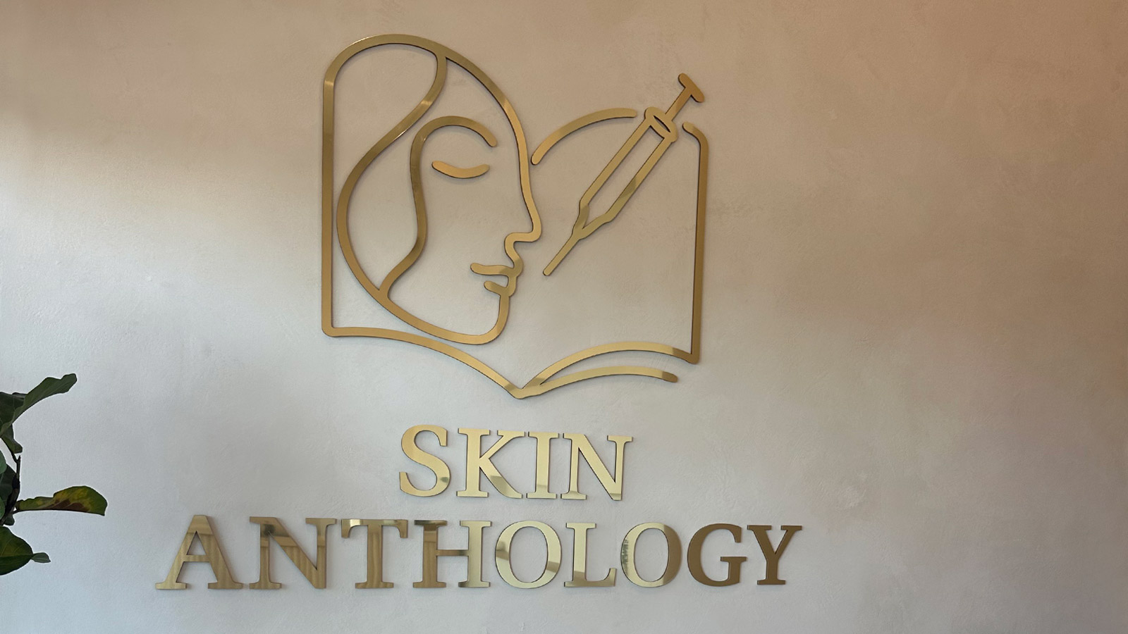 skin anthology dibond gold logo and letters on med spa wall