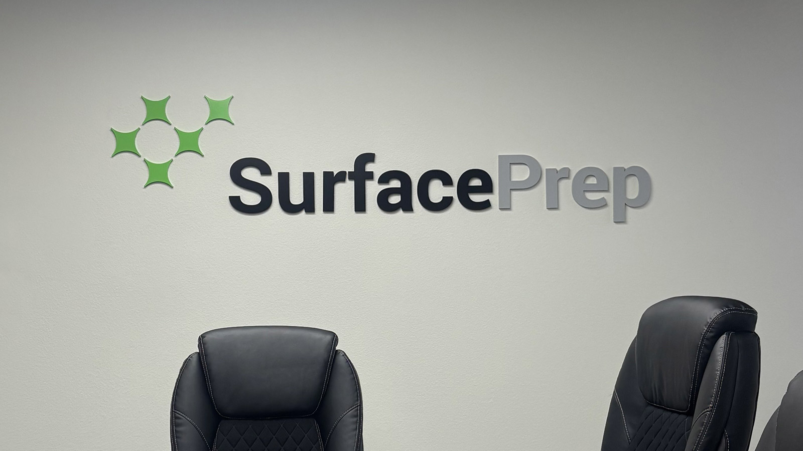 surfaceprep non-lit acrylic sign on conference room wall