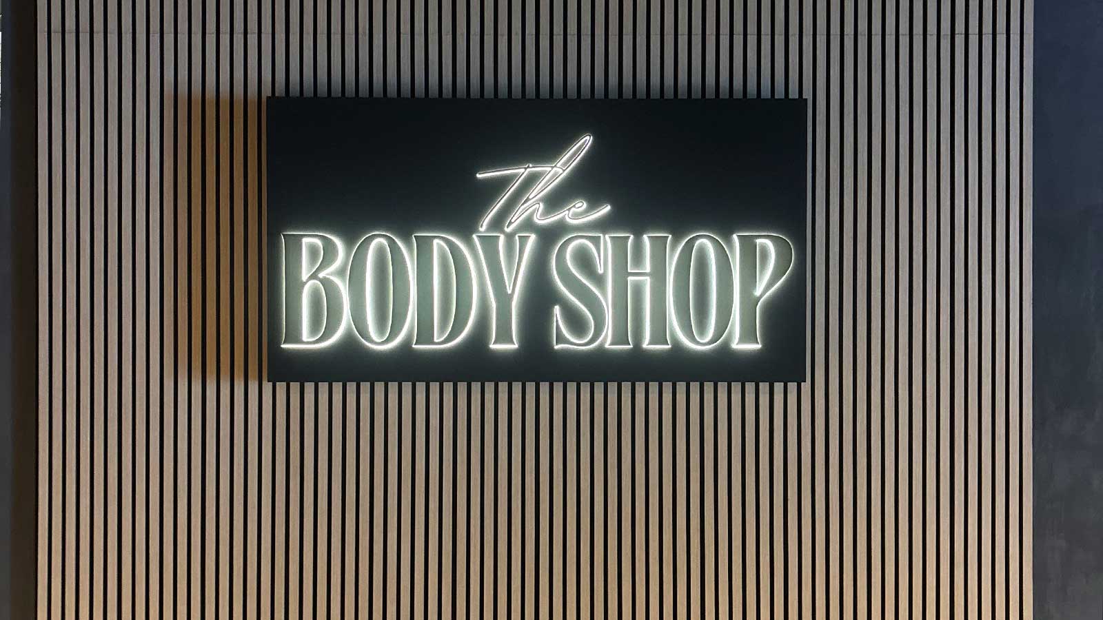 the body shop lightbox sign led upgraded on interior wall