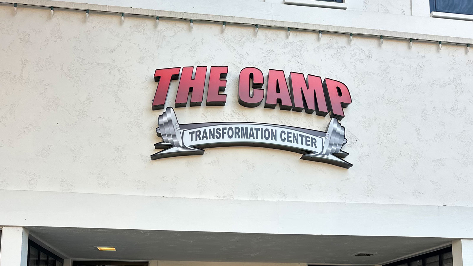 the camp transformation center front-lit sign on facade