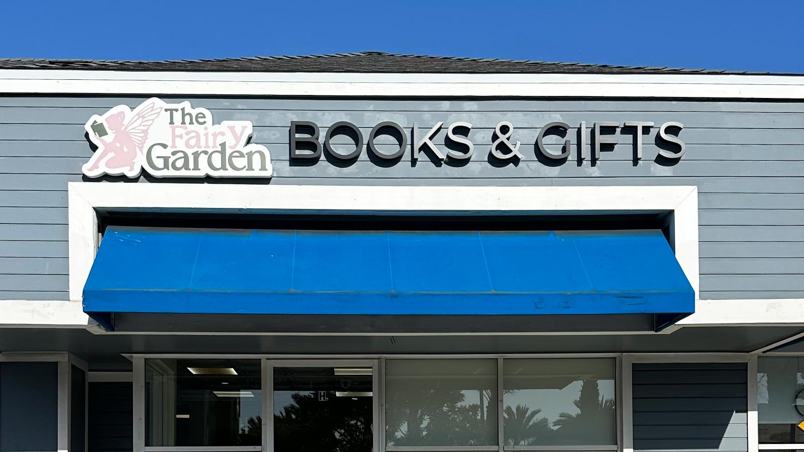 the fairy garden back-lit logo and letters on shop facade