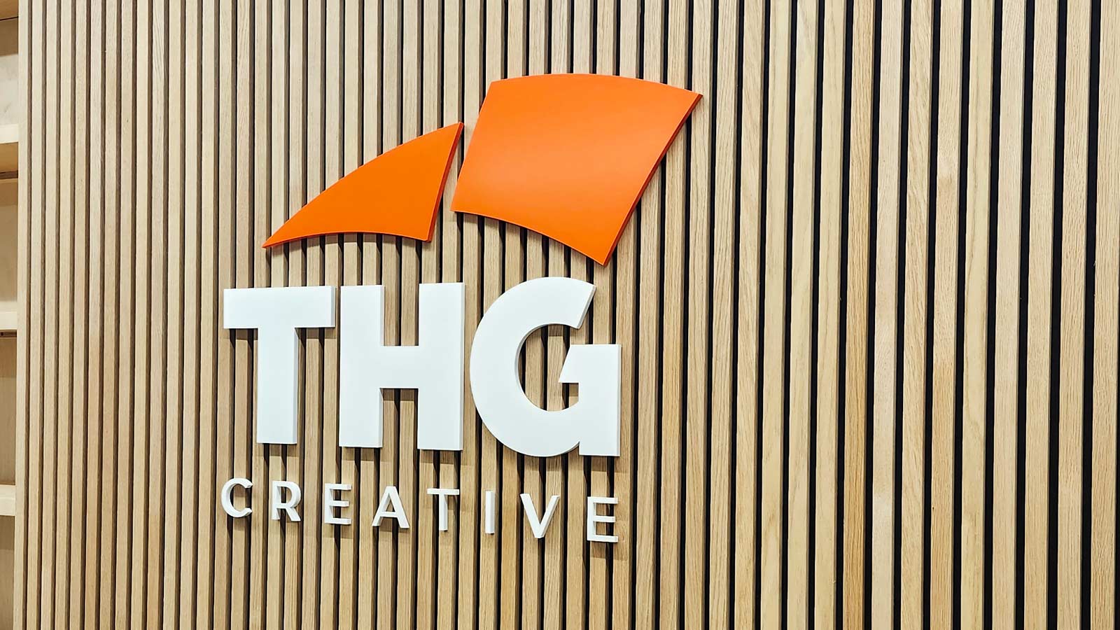 thg creative 3d acrylic logo and letters on lobby wall
