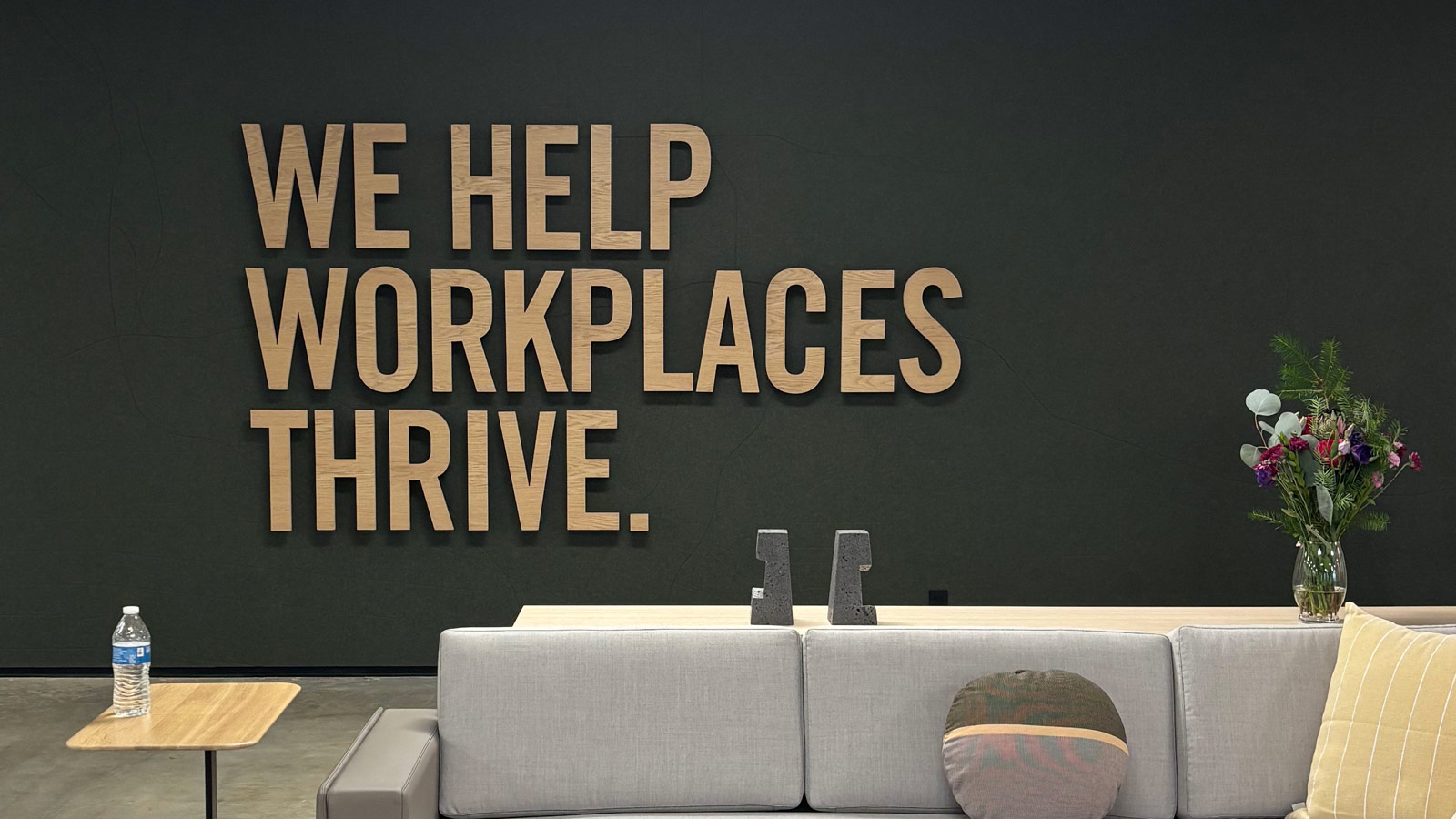 unisource pico oak lettering mounted on interior wall