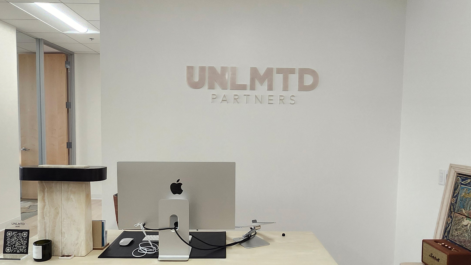 unlmtd partners acrylic letters mounted on office wall