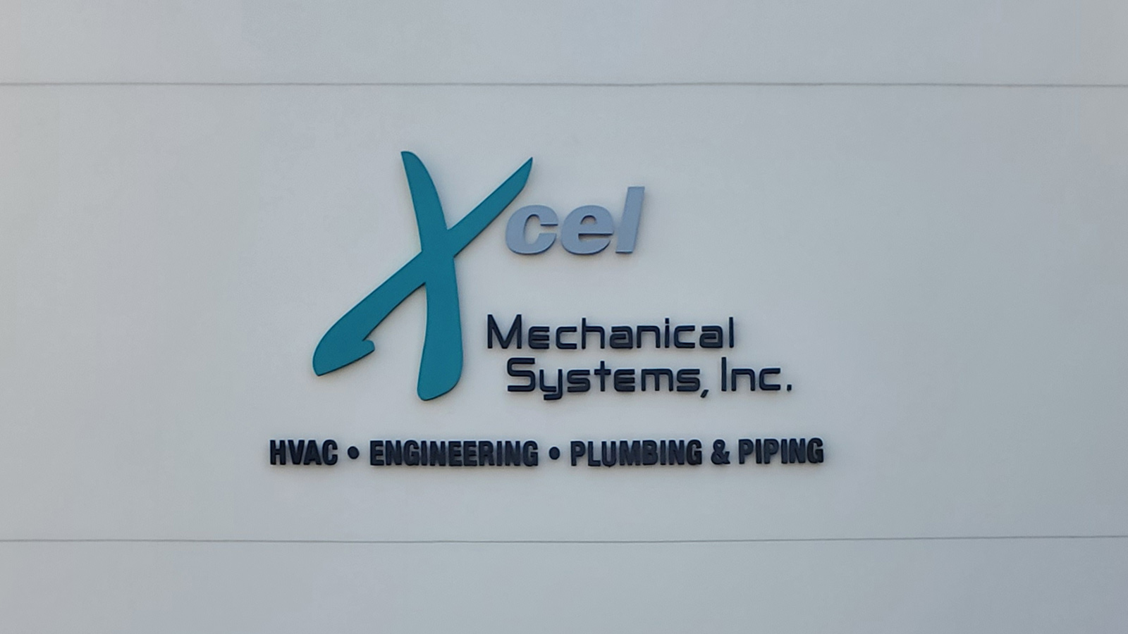 xcel mechanical acrylic sign relocated to new office