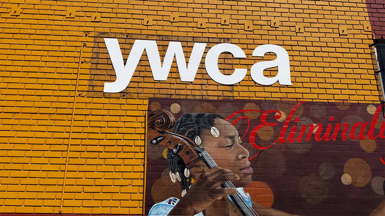 ywca gla white pvc letters mounted on brick wall