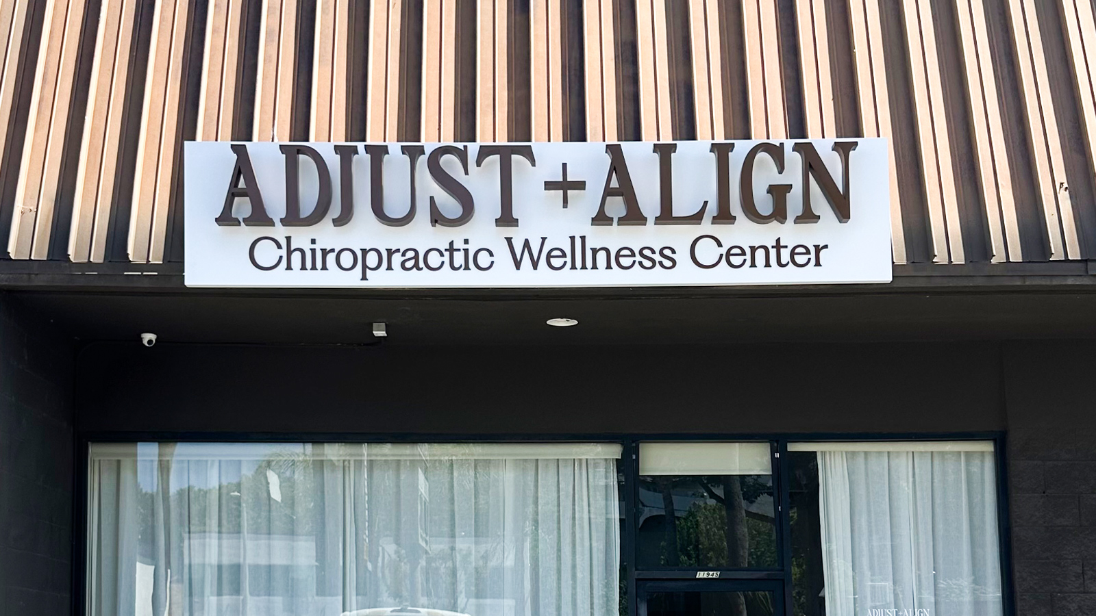adjust align backlit channel letters above storefront