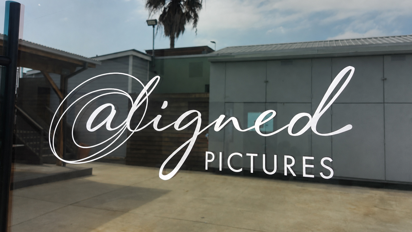 aligned pictures vinyl lettering on glass door