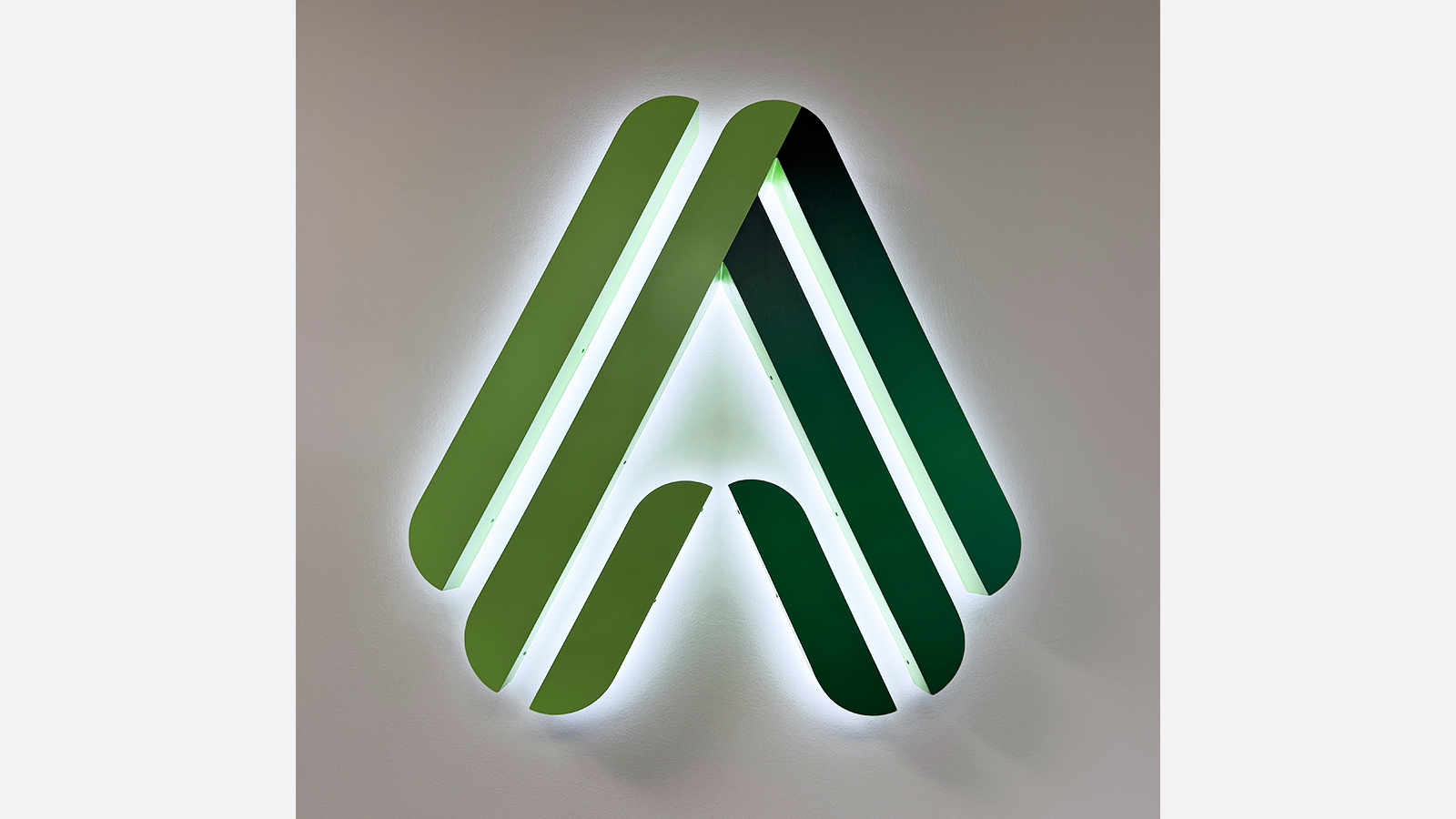 altasciences backlit logo sign on interior wall