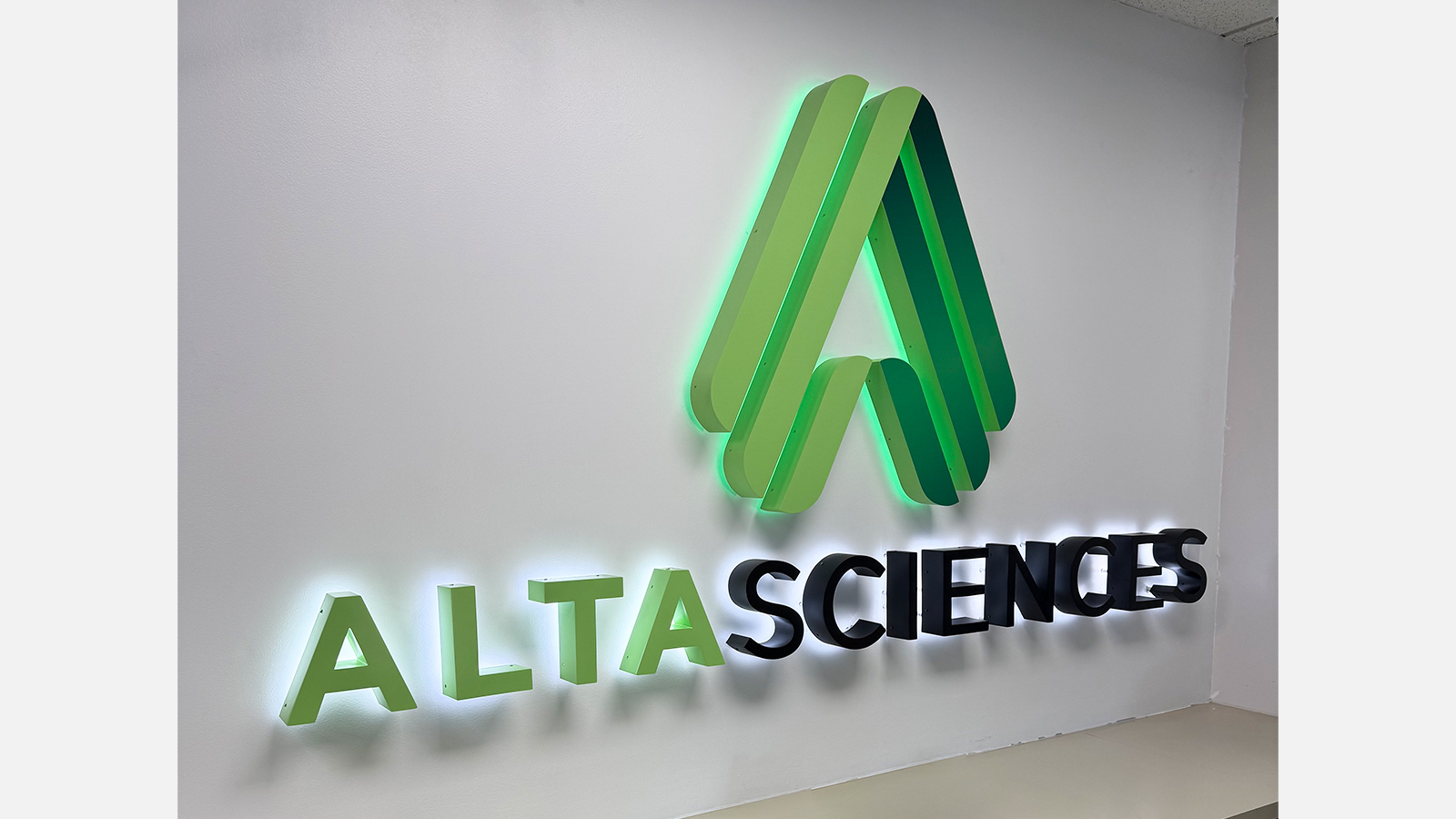 altasciences backlit mountain logo on lobby wall