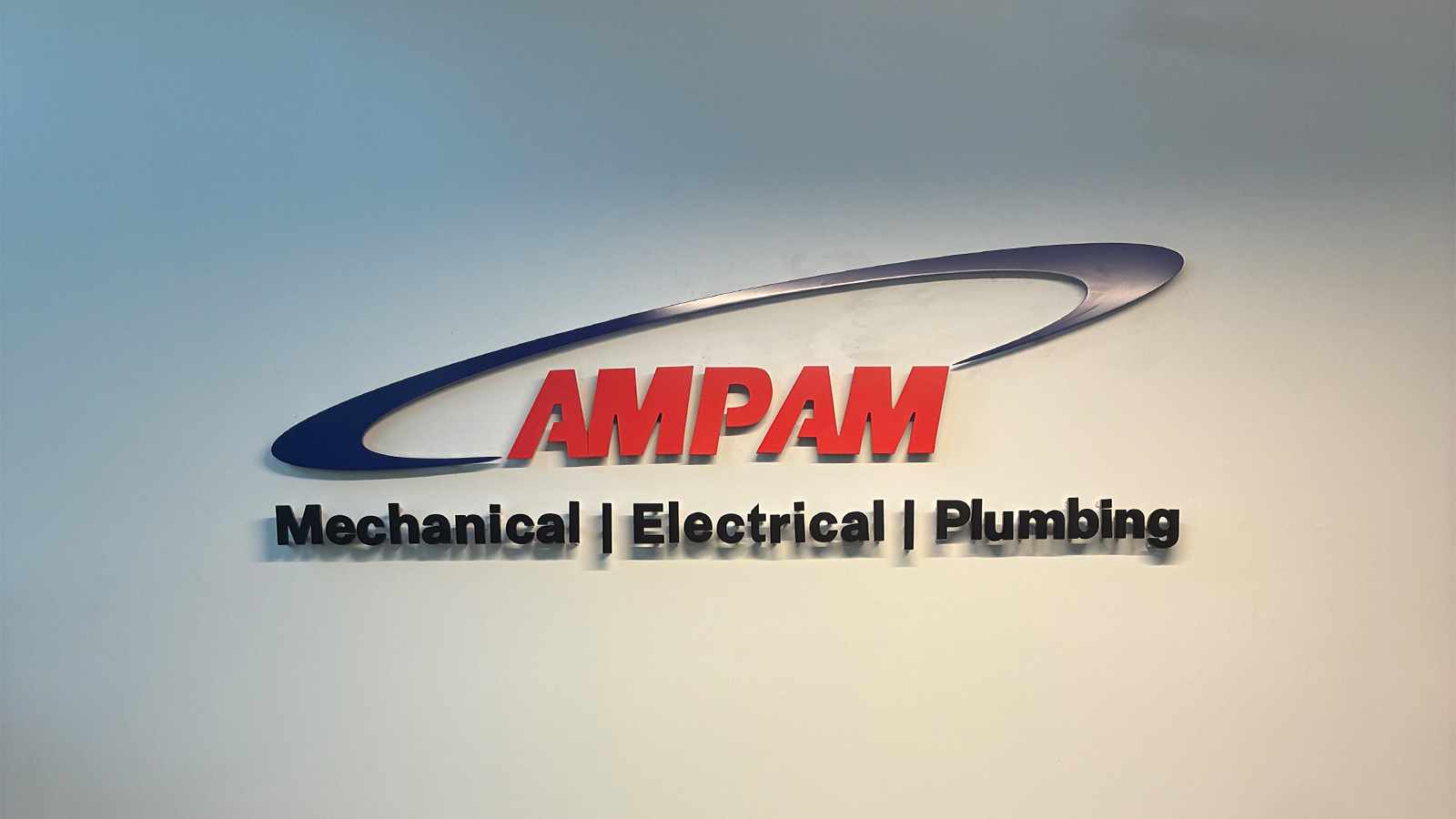 ampam painted acrylic tagline on interior wall