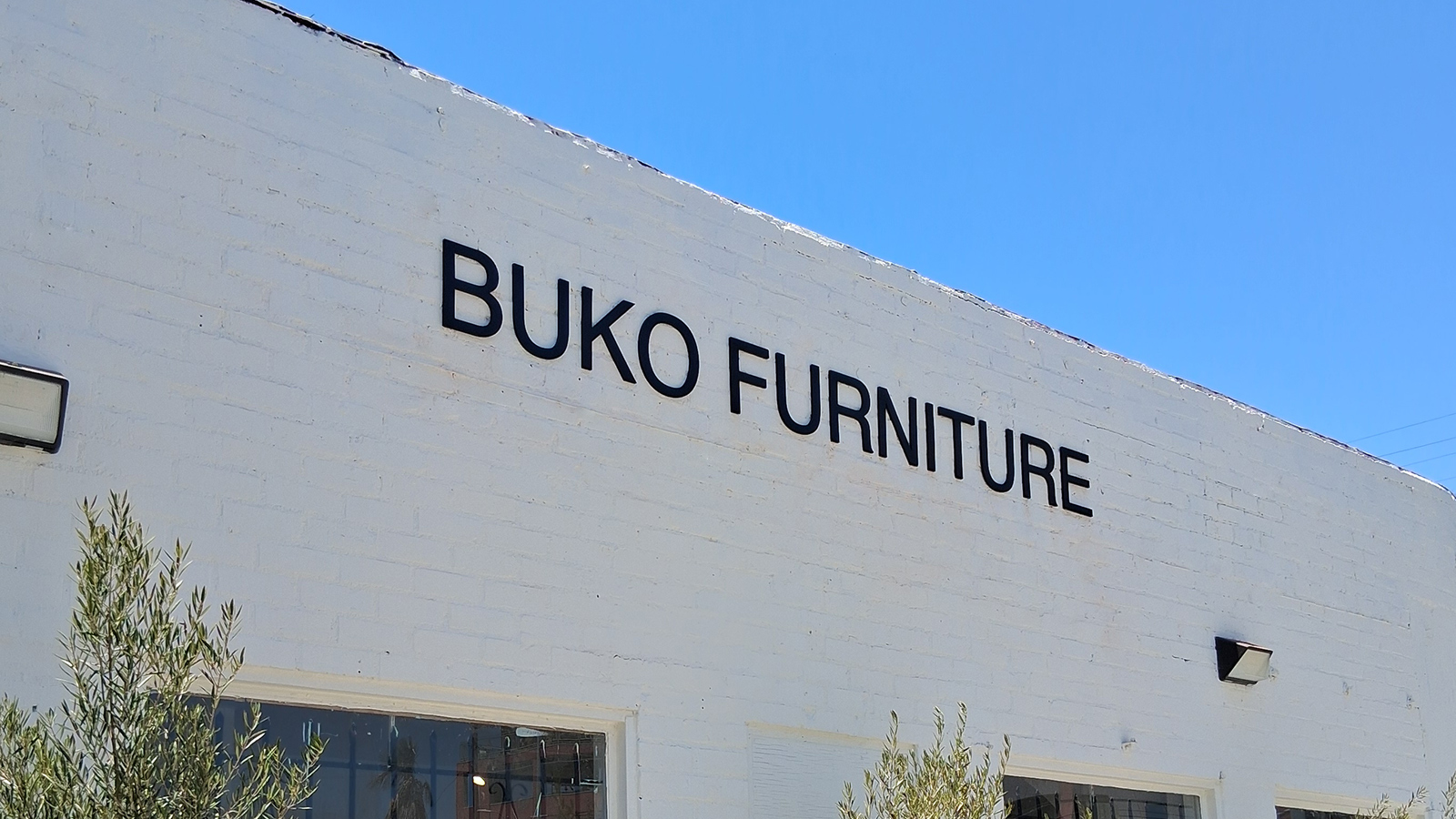 buko furniture pvc letters on brick facade
